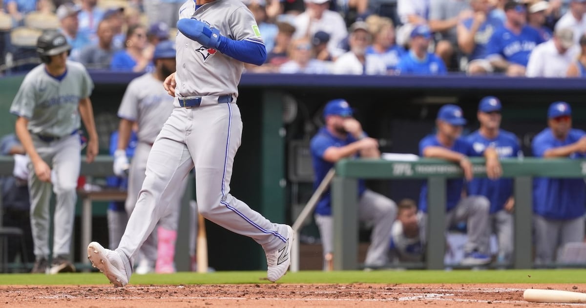Blue Jays clinch playoff spot with 8-5 win over Royals