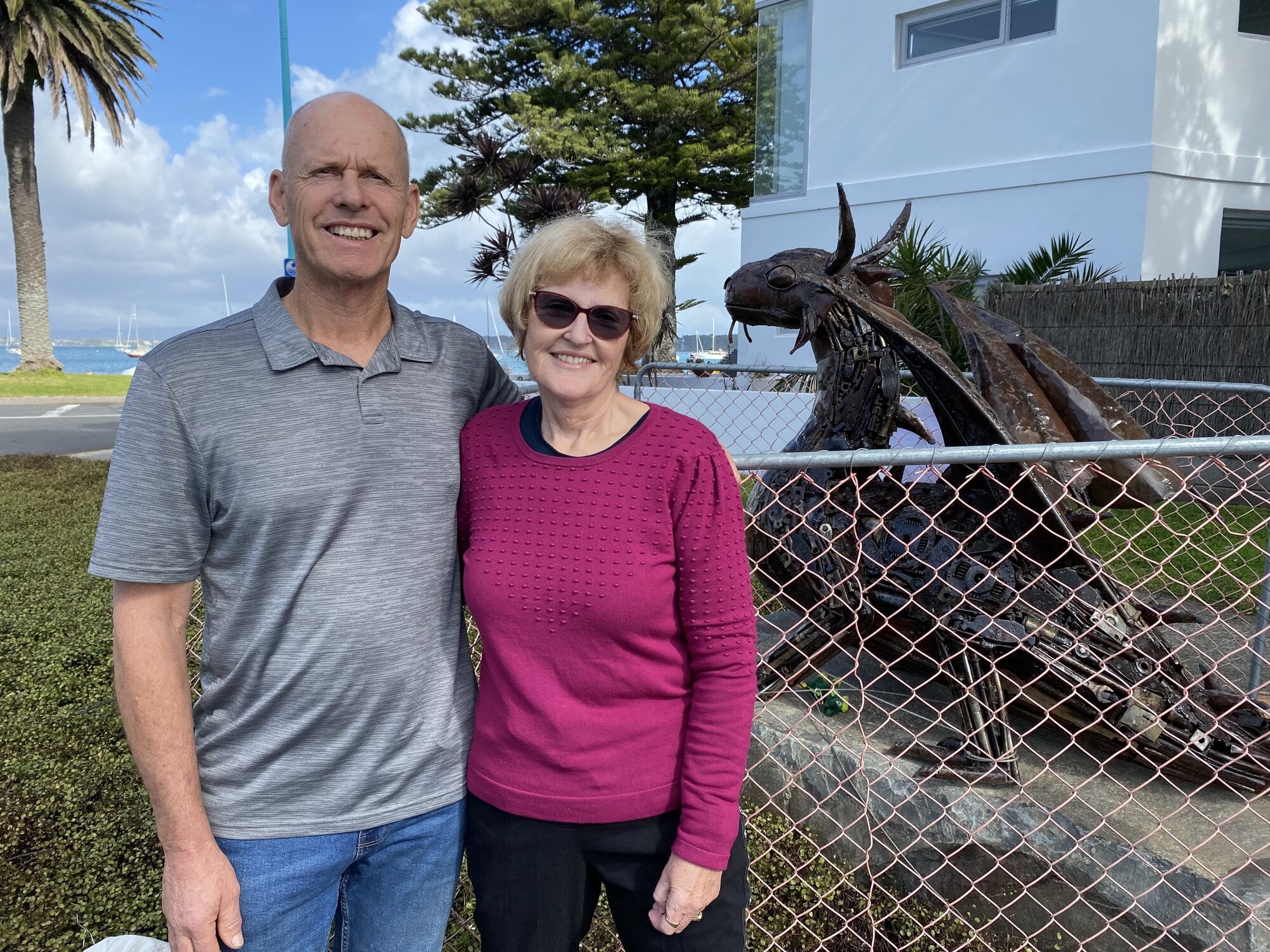 Graham and Carol Foote next to their 1.2m metal dragon sculpture which they have placed at the end of Commons Ave, Mount Maunganui.  Photo / Rosalie Liddle Crawford