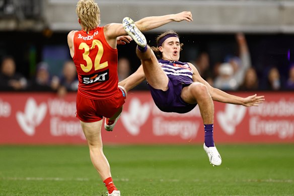 Bodhi Uwland of the Suns and Murphy Reid of the Dockers compete in a marking contest