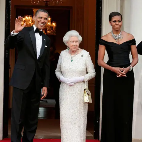 Rota/Anwar Hussein/Getty Images Queen Elizabeth II stands between Barack and Michelle Obama