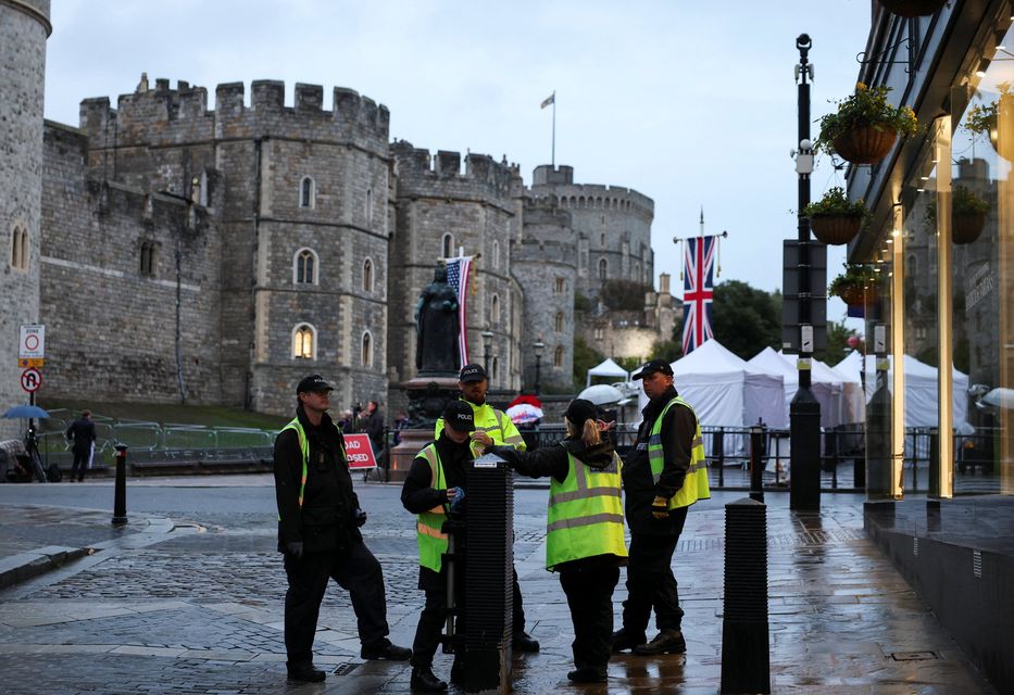 Police officers stand on duty at Windsor Castle, on the day of the state visit of U.S. President Donald Trump and First Lady Melania Trump to the UK, in Windsor, Britain, September 17, 2025. REUTERS/Phil Noble