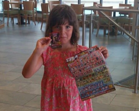 Tamzin Hall as a child, holding a book of stickers
