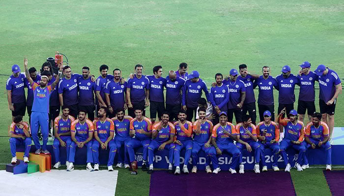 India players and staff pose for a team group photo after winning the Asia Cup against Pakistan at Dubai International Cricket Stadium, Dubai, United Arab Emirates, September 29, 2025. — Reuters
