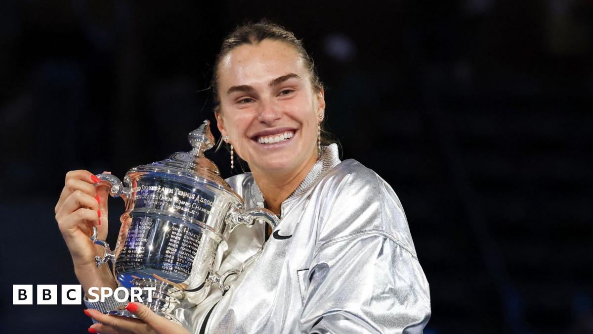 Aryna Sabalenka cradles the US Open trophy