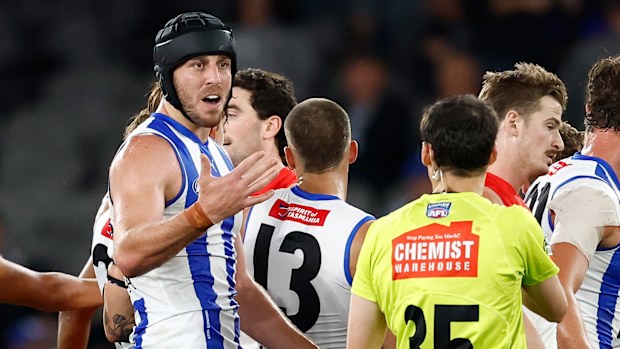 Tristan Xerri of the Kangaroos speaks with the umpire during the 2025 AFL Round 04 match between the North Melbourne Kangaroos and the Sydney Swans at Marvel Stadium on April 5, 2025 in Melbourne, Australia. (Photo by Michael Willson/AFL Photos via Getty Images)