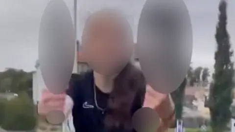 Facebook A picture of a teenager holding items that have been blurred for legal reasons. The teenager's identity has also been hidden