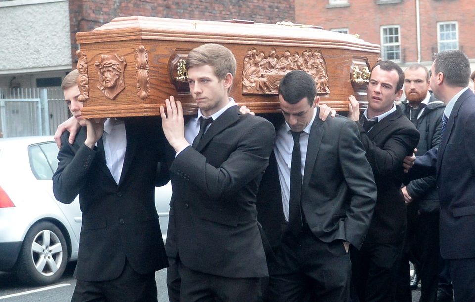 Patrick Hutch Jnr (front,right) and James 'Mago' Gately (back,right) carry the coffin of Gary Hutch