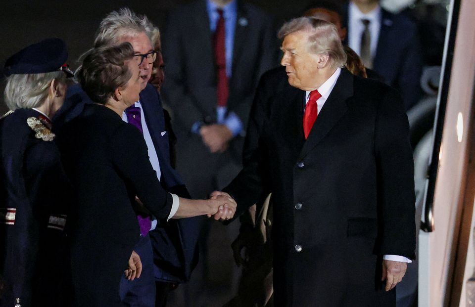U.S. President Donald Trump shakes hands with British Foreign Secretary Yvette Cooper as he and U.S. first lady Melania Trump arrive for their state visit to Britain, at London Stansted Airport near London, Britain, September 16, 2025. REUTERS/Chris Radburn
