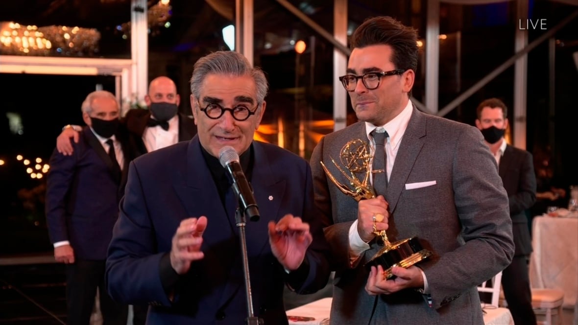 Eugene Levy, left, and Daniel Levy from "Schitt's Creek" accept the Emmy for Outstanding Comedy Series during the 72nd Emmy Awards.