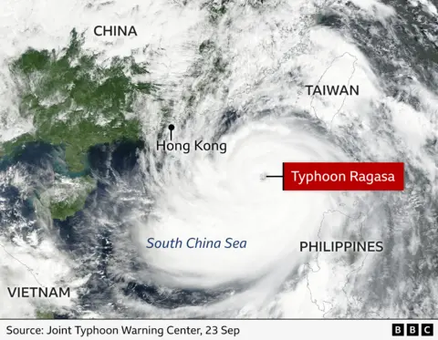 Satellite image showing typhoon Ragasa over Asia. The eye of the hurricane is marked with a red label. We can see clouds over Taiwan, the Philippines, Vietnam, China and the South China sea, as well as Hong Kong.