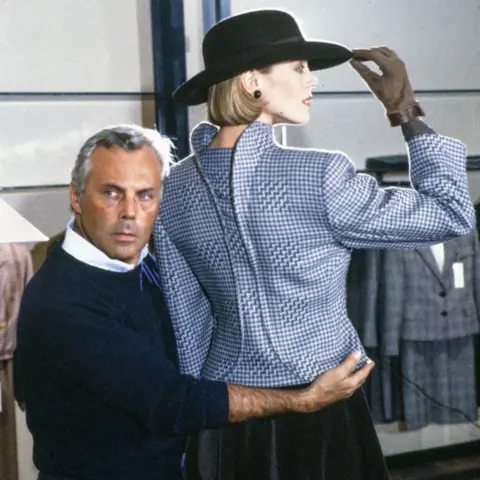 Getty Images Giorgio Armani and a model