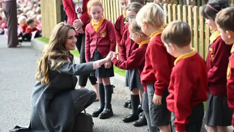 PA Media Catherine met pupils at Farnborough Road Infant and Junior School in Southport