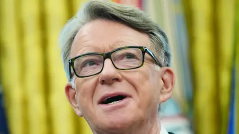 EPA A close up of British Ambassador to the United States Peter Mandelson during a visit to see Donald Trump in the Oval Office of the White House. He is wearing dark-framed glasses.