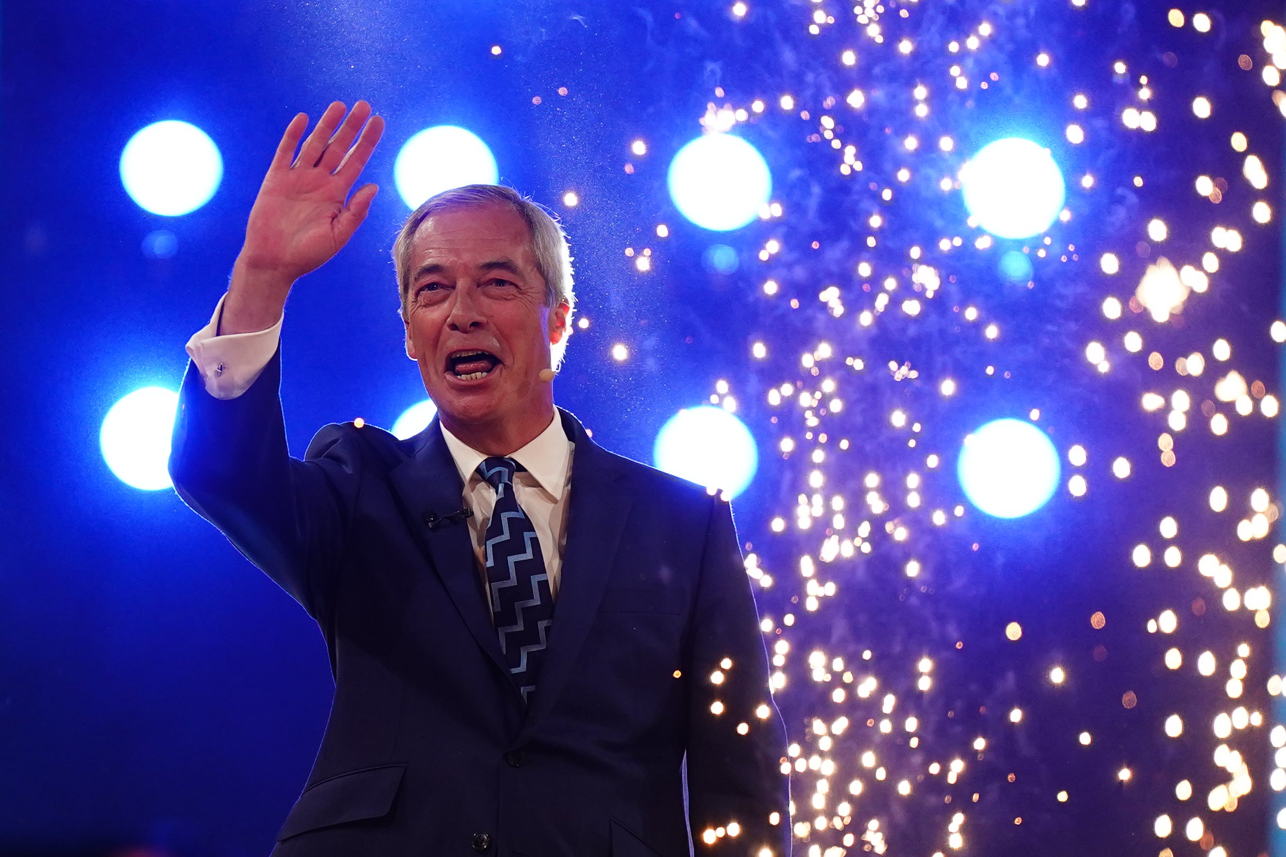 Reform UK leader Nigel Farage waves to the audience after his speech at the party’s annual conference (Jacob King/PA)