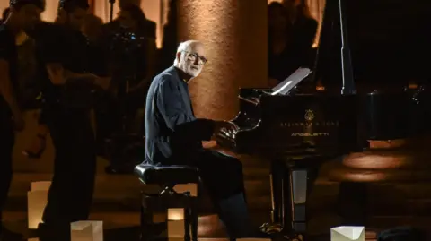 EPA Live piano music was performed by Italian composer Ludovico Einaudi