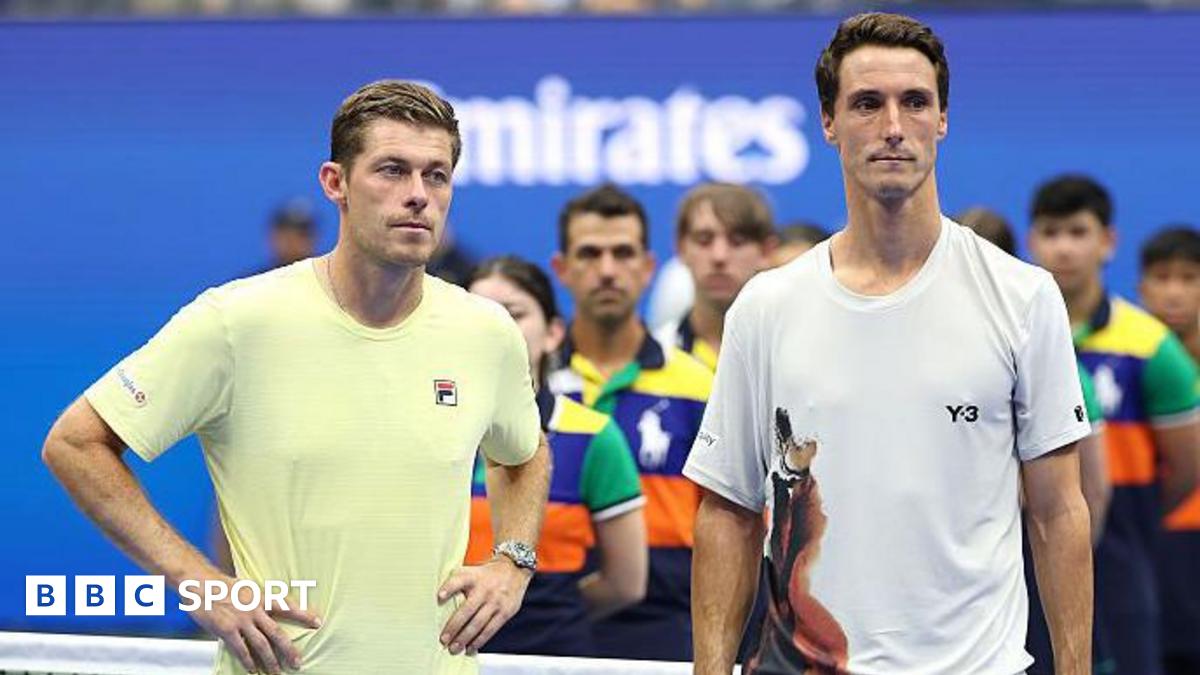 Joe Salisbury and Neal Skupski stand on court at the US Open