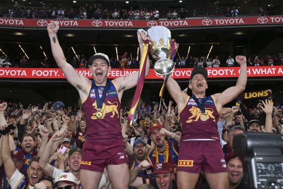Lachie Neale and Dayne Zorko celebrate the 2024 grand final win.