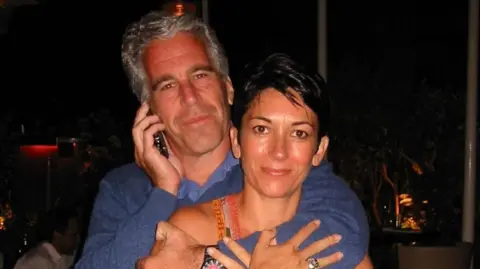 Department of Justice Undated handout file photo issued by US Department of Justice of Ghislaine Maxwell with Jeffrey Epstein