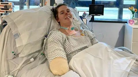 BBC Lily in a hospital bed after having all four limbs amputated