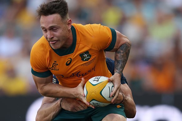 Corey Toole of the Wallabies is tackled.