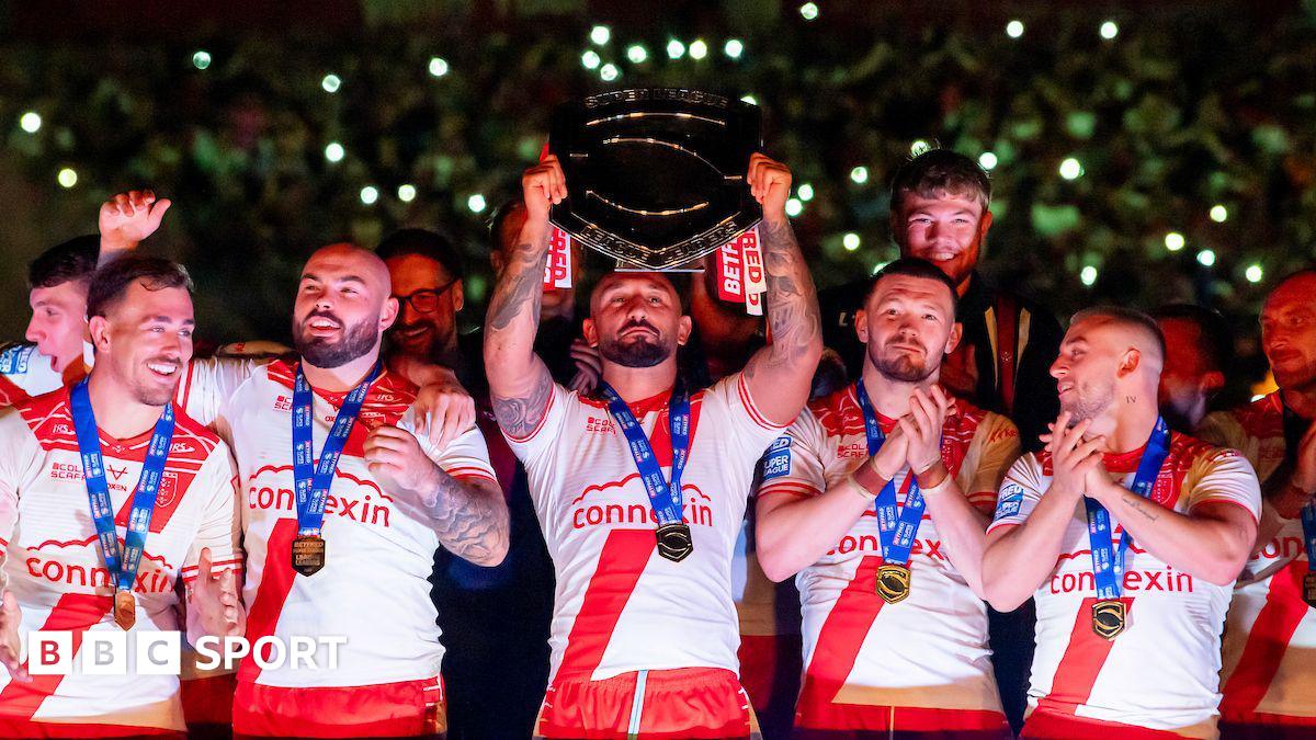 Hull Kingston Rovers captain Elliot Minchella lifts the League Leaders' Shield, surrounded by teammates