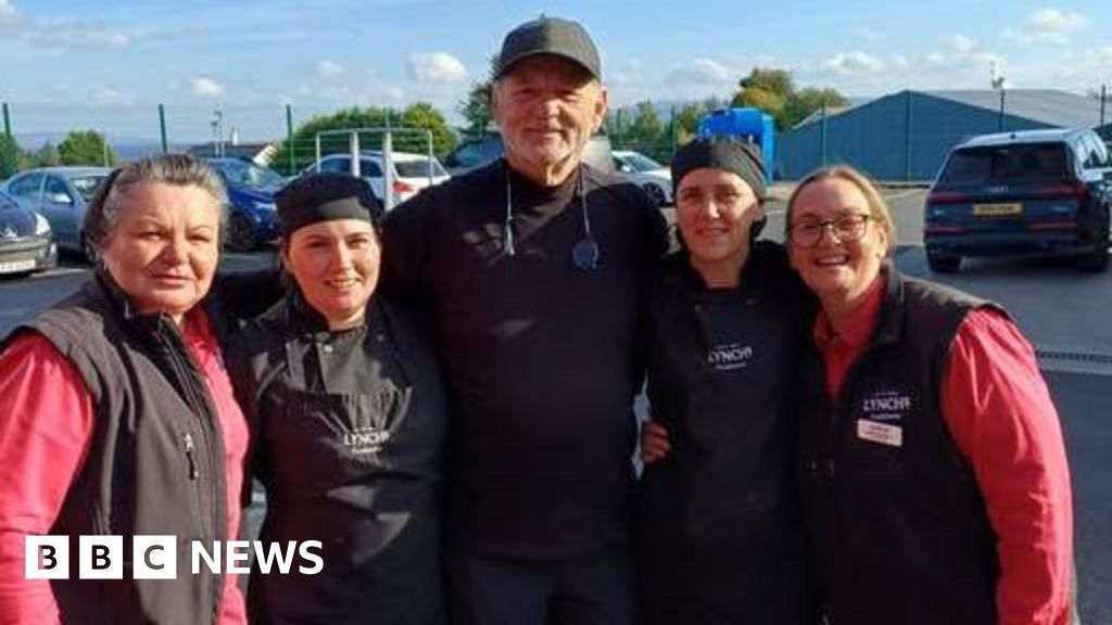 Actor Bill Murray poses for photographs at Greysteel garage