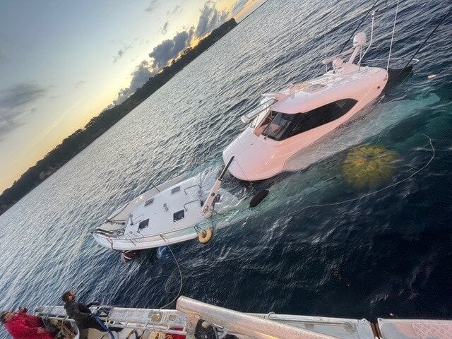 The launch being raised from the sea floor near Mōtītī Island after it hit submerged rocks on May 16. Photo / Sean Kelly, Pacific 7 Ltd