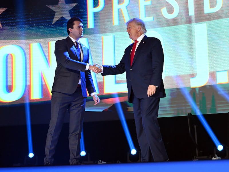 Charlie Kirk with Donald Trump at a rally in Tampa, Florida in 2022. Photograph: Todd Anderson/The New York Times
                      