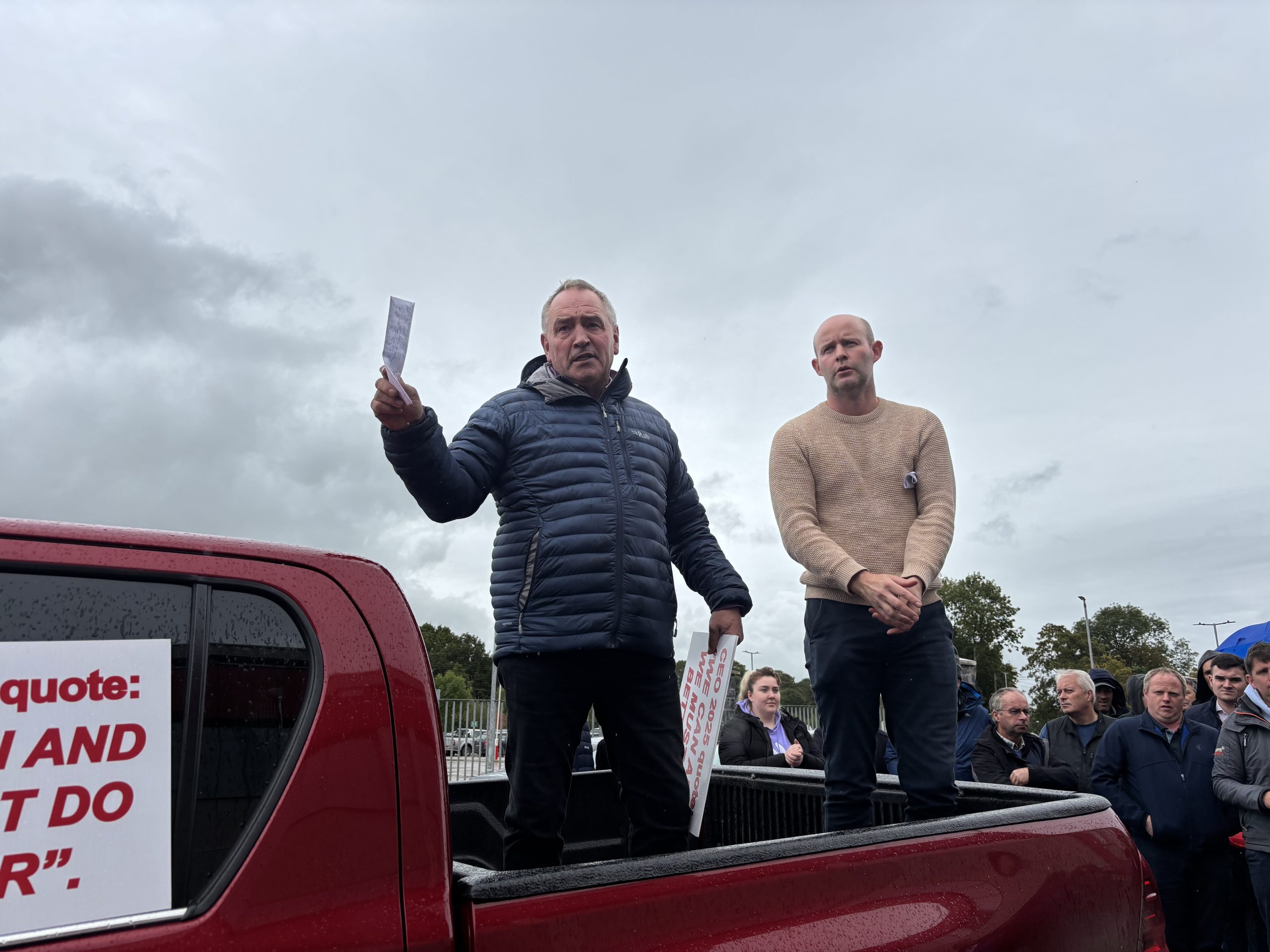 Nigel Sweetnam and Eoin Bourke address farmers gathered outside Dairygold in Mitchelstown.