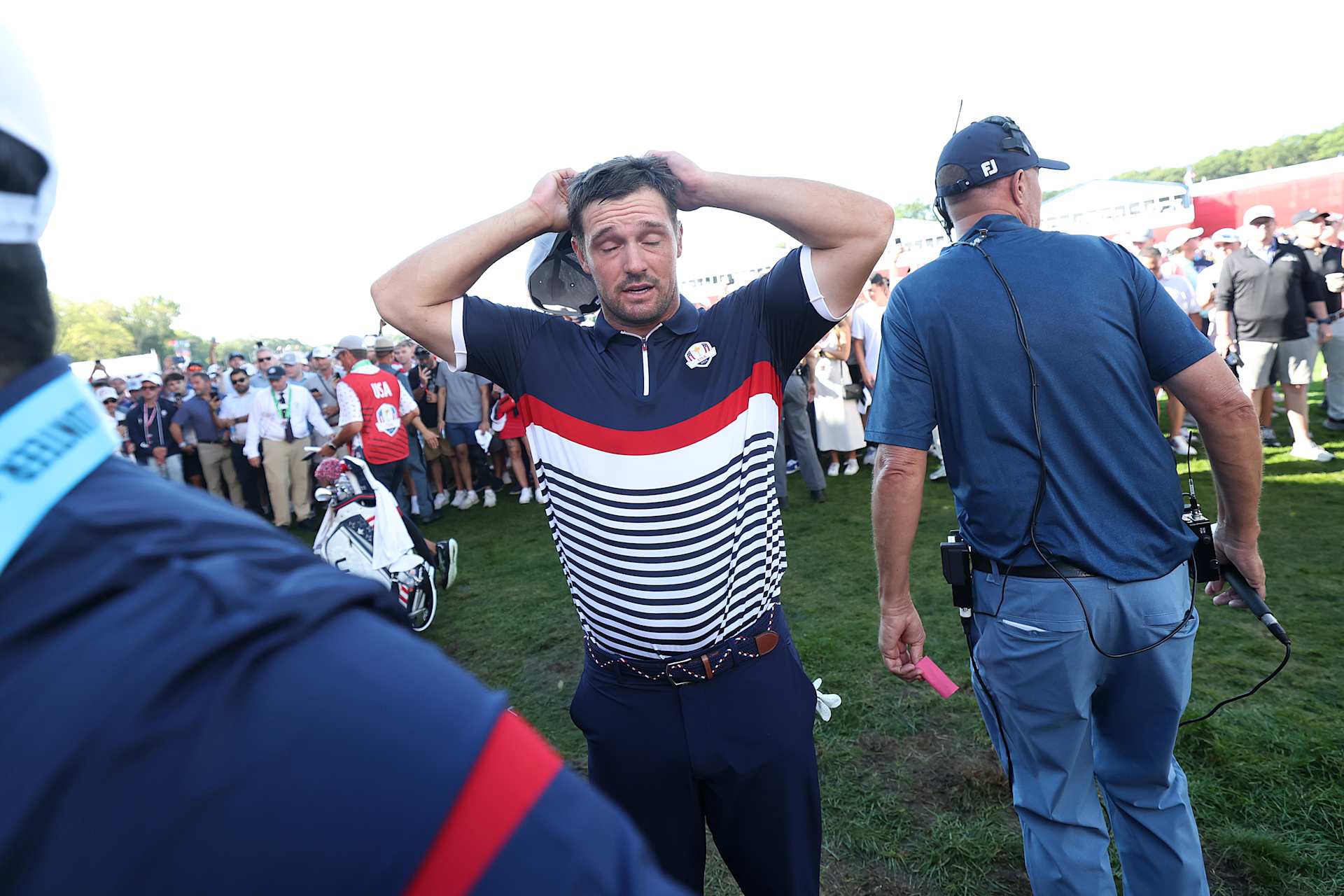 FARMINGDALE, NEW YORK - SEPTEMBER 26: Bryson DeChambeau of Team United States reacts on the 15th green after being defeated 4&3 by Jon Rahm and Tyrrell Hatton of Team Europe during the Friday morning foursomes matches of the 2025 Ryder Cup at Black Course at Bethpage State Park Golf Course on September 26, 2025 in Farmingdale, New York. (Photo by Carl Recine/Getty Images)