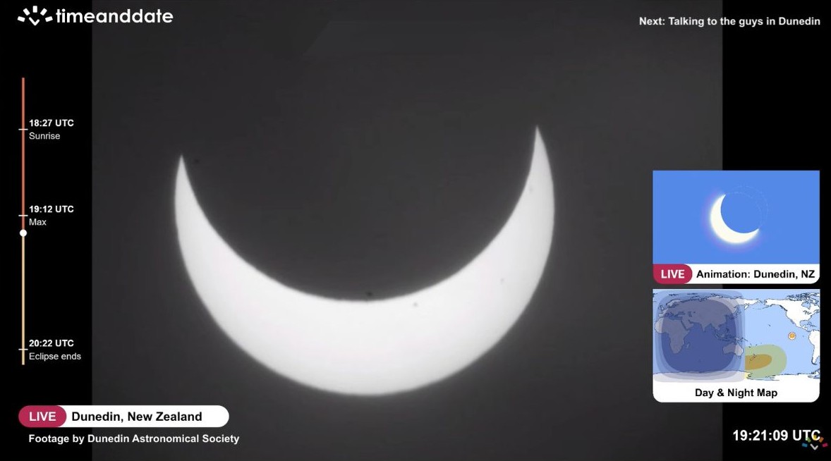 A picture of the sun's disk with two thirds of its surface hidden by the spherical silhouette of the moon, transforming our parent star into a bright, upturned crescent.