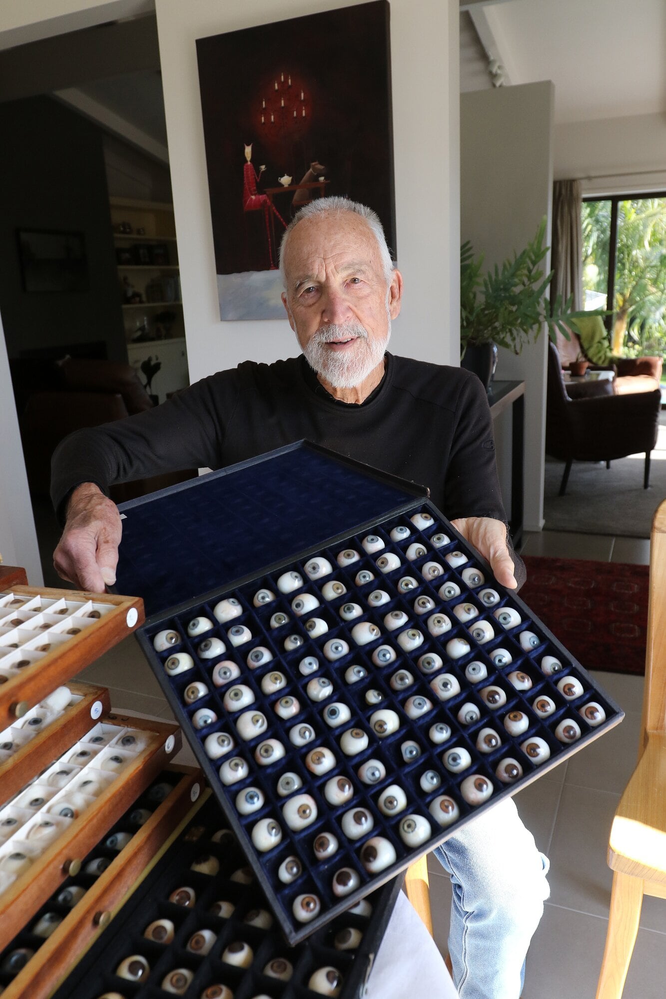  Bruce Brown with one of the trays from the prosthetic eye collection. Photo / Stuart Whitaker