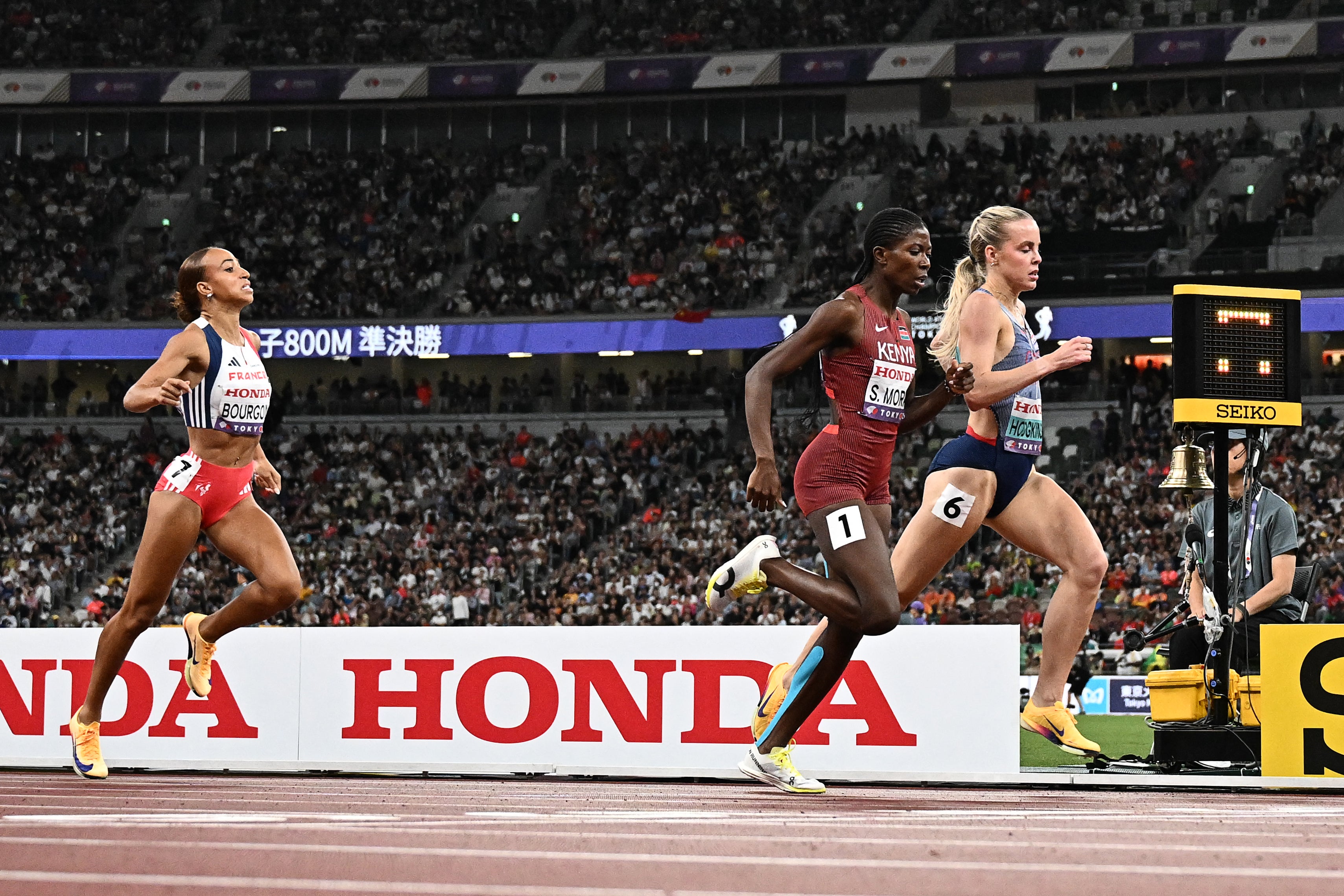 France’s Anais Bourgoin, Kenya’s Sarah Moraa and Great Britain’s Keely Hodgkinson finish their 800m semi-final