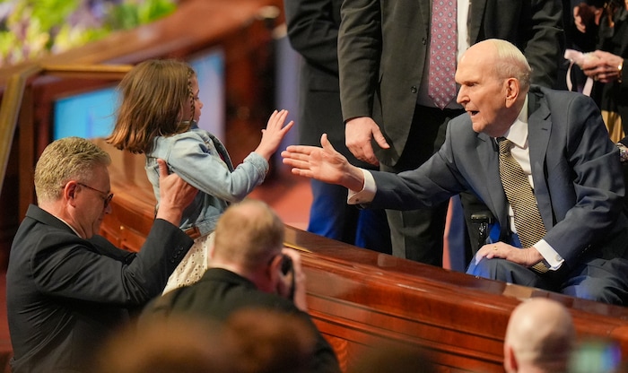 (Chris Samuels | The Salt Lake Tribune) President Russell M. Nelson greets 8-year-old Ella Hadley, from Syracuse, at the conclusion of General Conference of The Church of Jesus Christ of Latter-day Saints in Salt Lake City, Sunday, April 6, 2025.