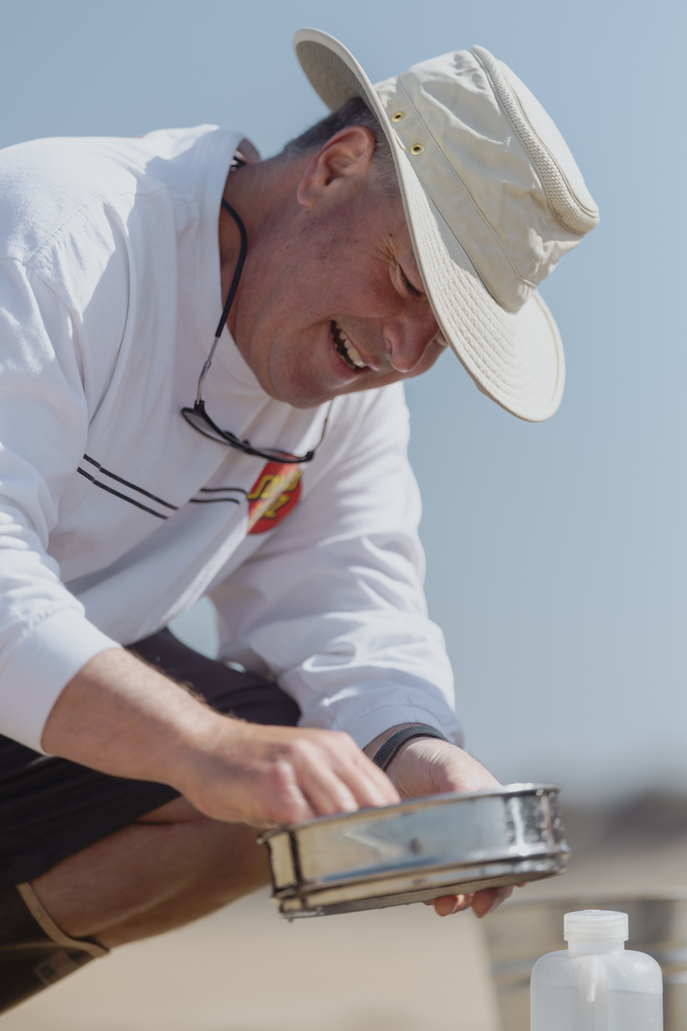 Image of Steve Lonhart working on collecting samples at the beach.