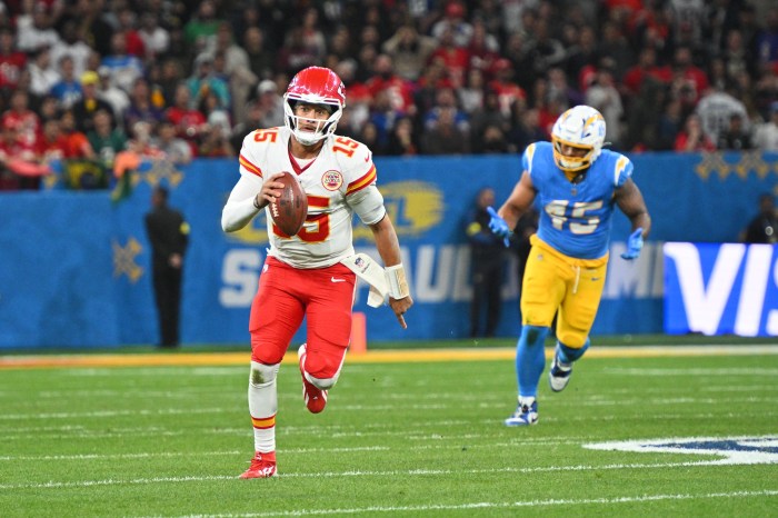 Kansas City Chiefs quarterback Patrick Mahomes runs the ball