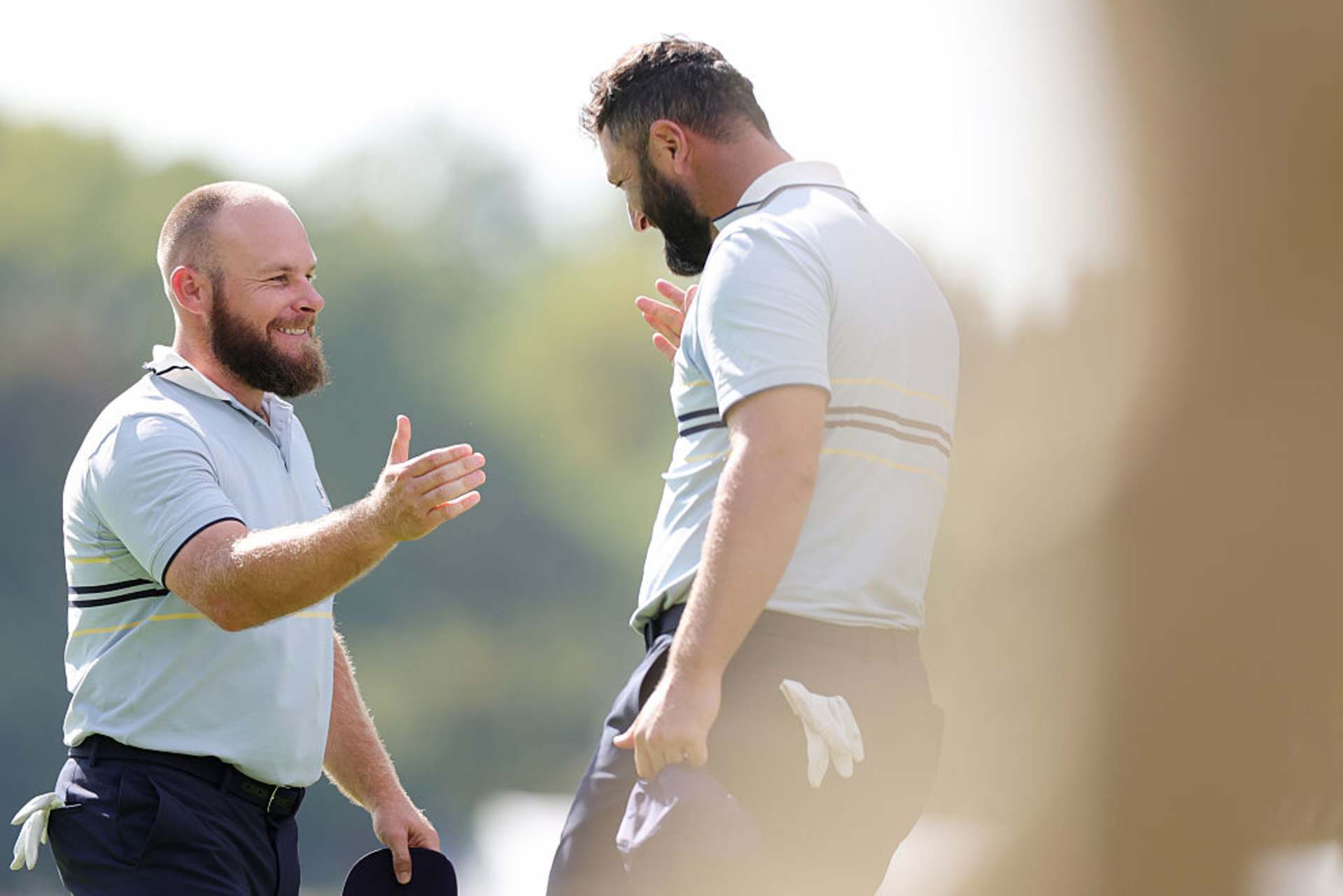 FARMINGDALE, NEW YORK - SEPTEMBER 26: Tyrrell Hatton and Jon Rahm of Team Europe celebrate defeating Bryson DeChambeau and Justin Thomas of Team United States 4&3 during the Friday morning foursomes matches of the 2025 Ryder Cup at Black Course at Bethpage State Park Golf Course on September 26, 2025 in Farmingdale, New York. (Photo by Andrew Redington/Getty Images)