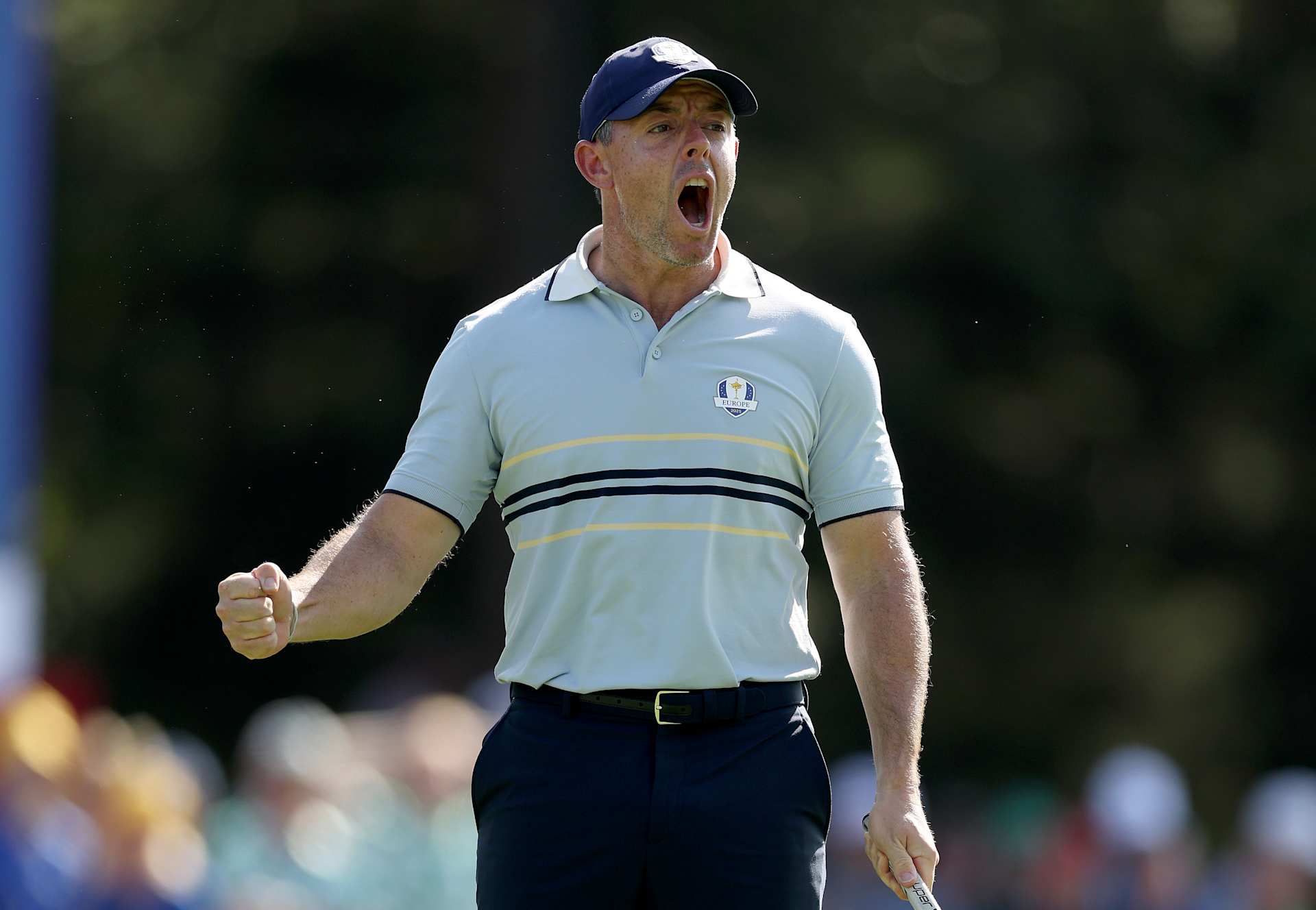 FARMINGDALE, NEW YORK - SEPTEMBER 26: Rory McIlroy of Team Europe reacts after making an eagle putt to win the seventh hole during the Friday afternoon four-ball matches of the 2025 Ryder Cup at Black Course at Bethpage State Park Golf Course on September 26, 2025 in Farmingdale, New York. (Photo by Richard Heathcote/Getty Images)