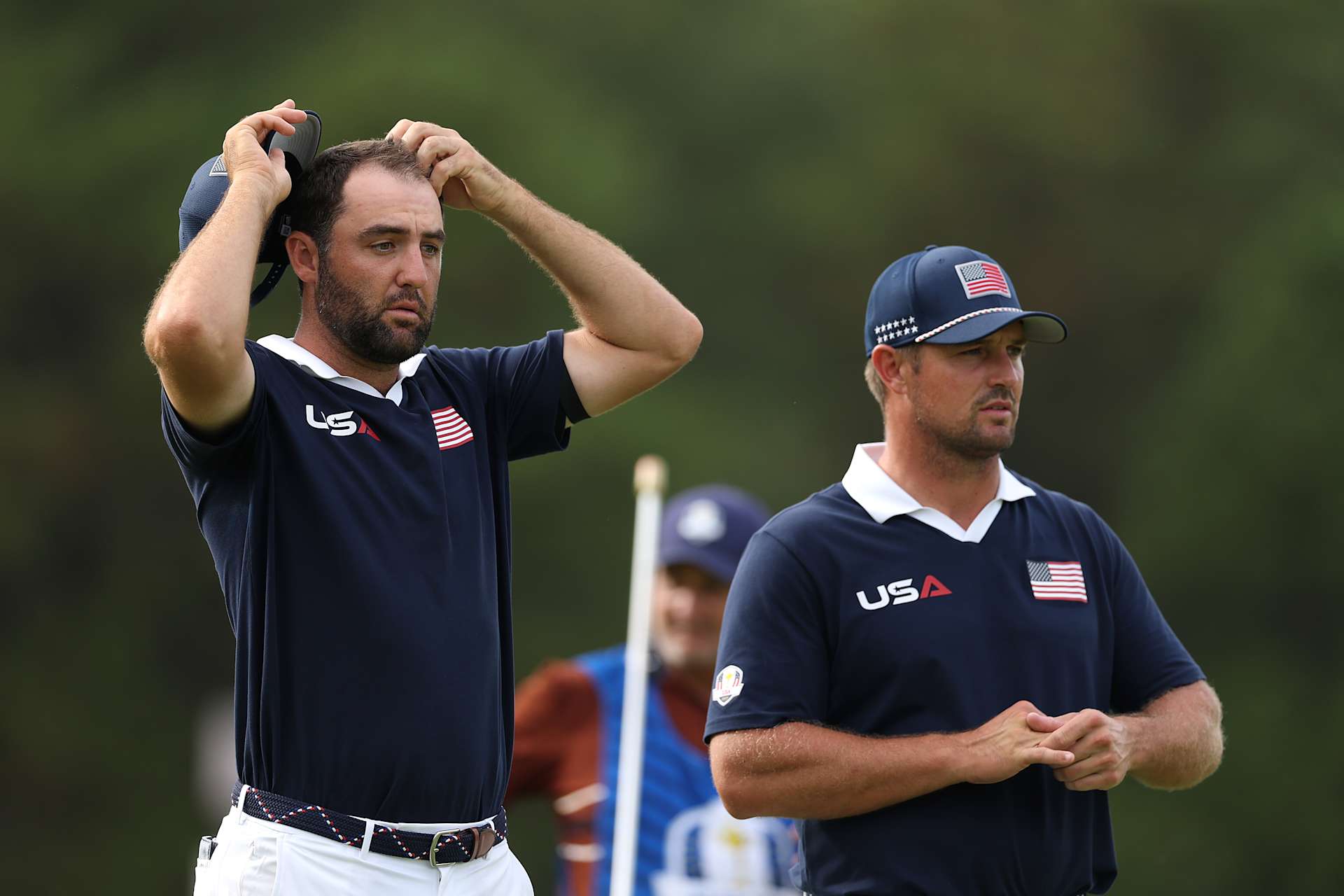 FARMINGDALE, NEW YORK - SEPTEMBER 27: Scottie Scheffler of Team United States and teammate Bryson DeChambeau look on while playing the 11th hole during the Saturday afternoon four-balls matches of the 2025 Ryder Cup at Black Course at Bethpage State Park Golf Course on September 27, 2025 in Farmingdale, New York. (Photo by Richard Heathcote/Getty Images)