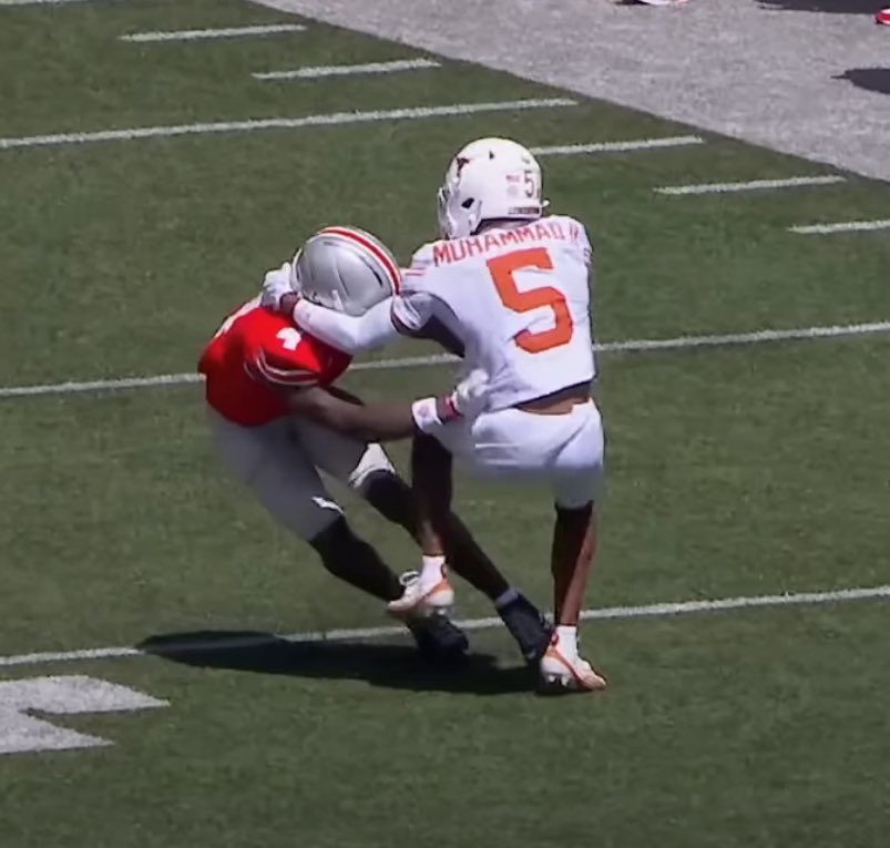 Malik Muhammad holding Jeremiah Smith