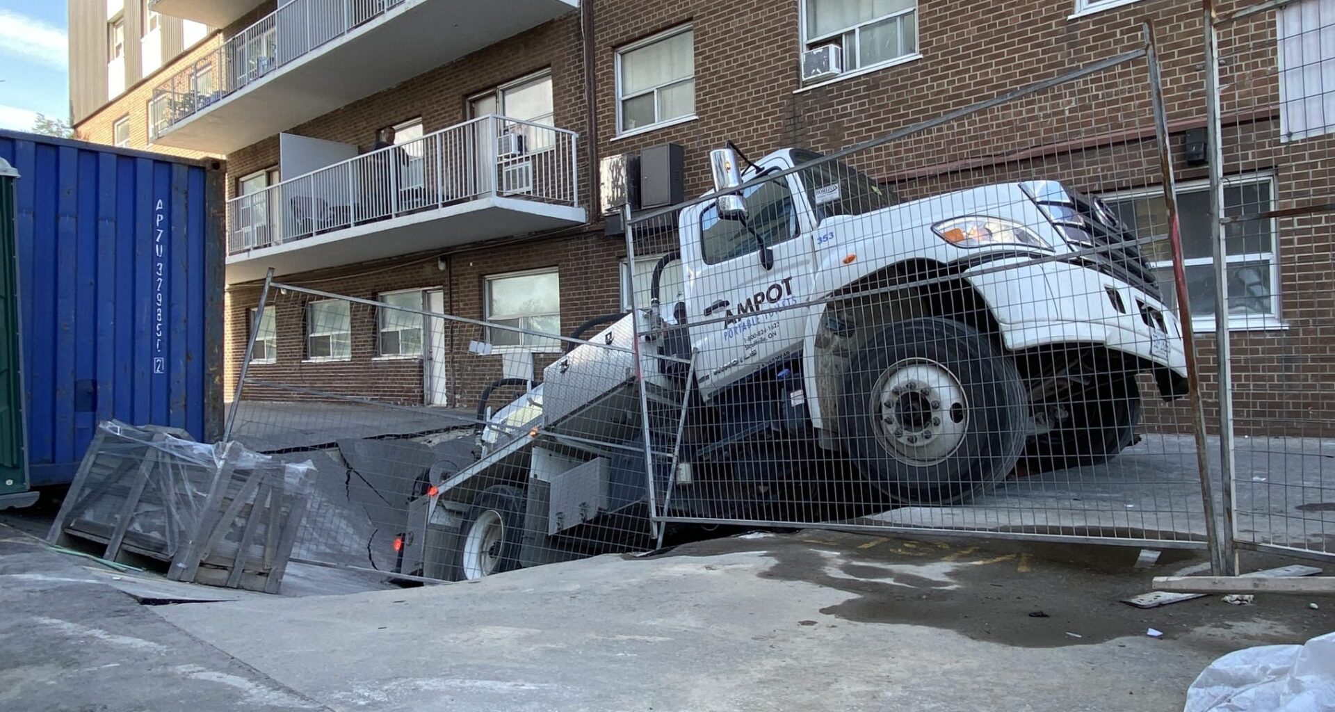 Collapsed parking garage swallows tanker truck near Weston Road