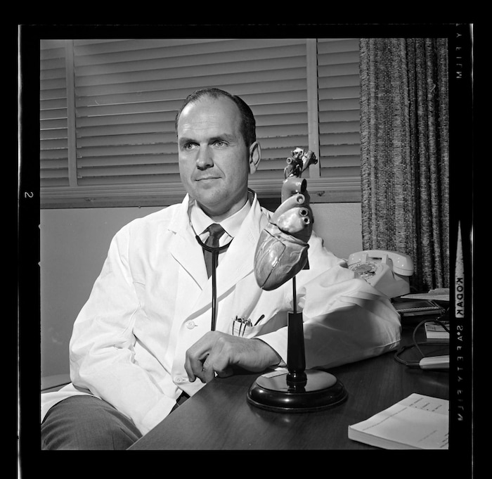 (Utah State Historical Society) Dr. Russell M. Nelson poses with a model of a heart in 1964.