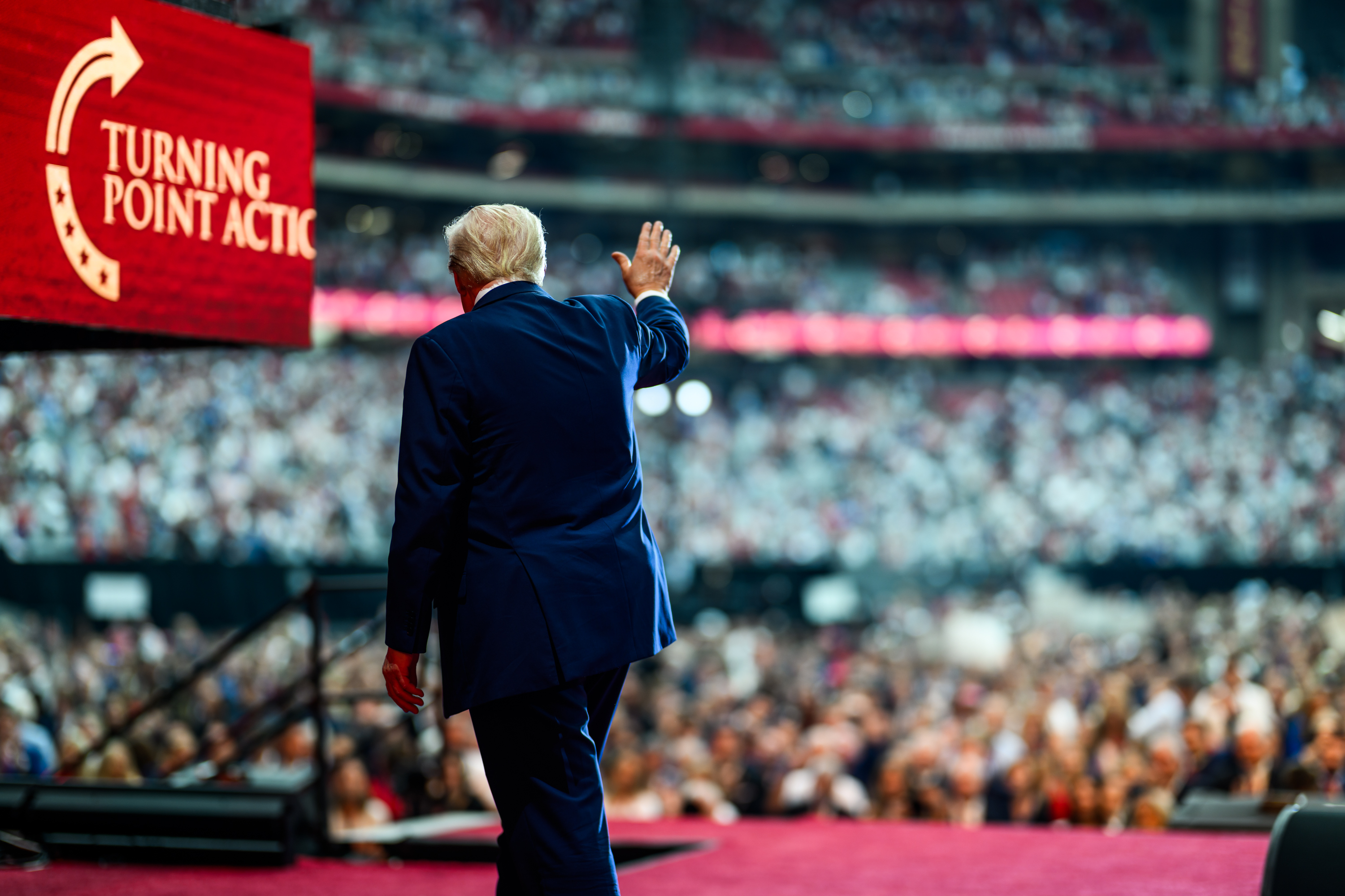 President Donald Trump takes the stage with Erika Kirk at the Memorial Service for Charlie Kirk at State Farm Stadium in Glendale, Arizona, Sunday, September 21, 2025. (Official White House Photo by Daniel Torok)