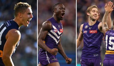 Three put pen to paper and sign on