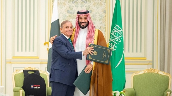 Saudi Crown Prince Mohammed bin Salman and Pakistan Prime Minister Shehbaz Sharif embrace each other on the day they sign a defence agreement, in Riyadh, Saudi Arabia, September 17, 2025.(via REUTERS)