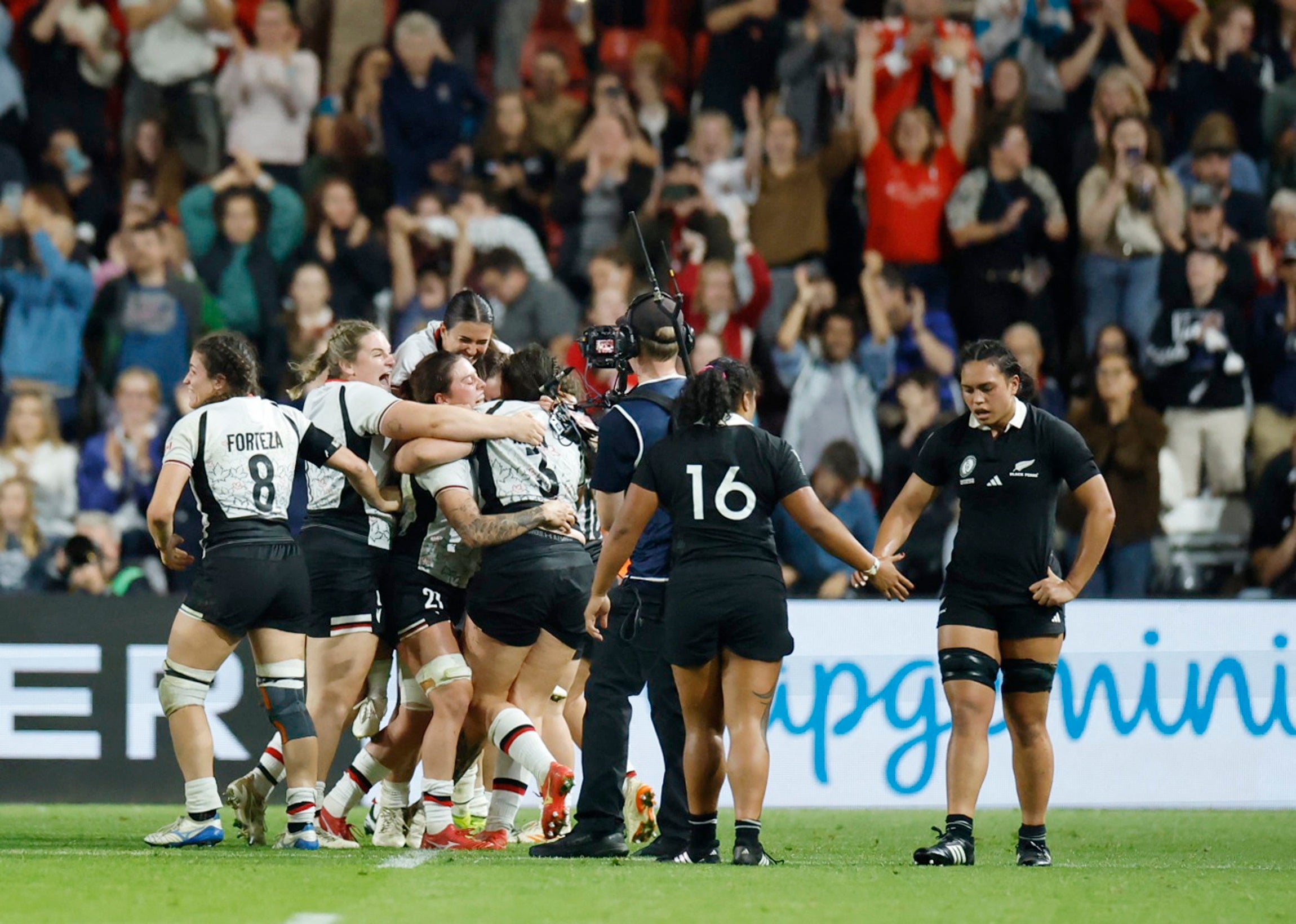 Canada players celebrate after beating New Zealand in the World Cup semi-finals