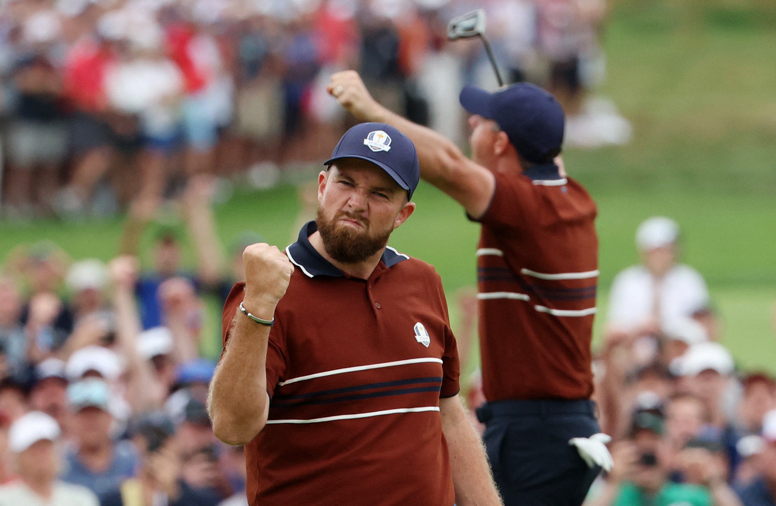 Lowry and McIlroy celebrate their victory