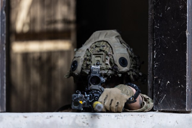 A British soldier takes part in urban combat exercise during a joint military manoeuvre between the French and British army at the Sissonne camp, north of the city of Reims, in northeastern France on April 22, 2025. Amid the soulless blocks of the ghost town of Jeoffrecourt, in north-eastern France, French and British soldiers train together in urban combat, learning the lessons of the war in Ukraine. (Photo by Sameer Al-DOUMY / AFP) (Photo by SAMEER AL-DOUMY/AFP via Getty Images)