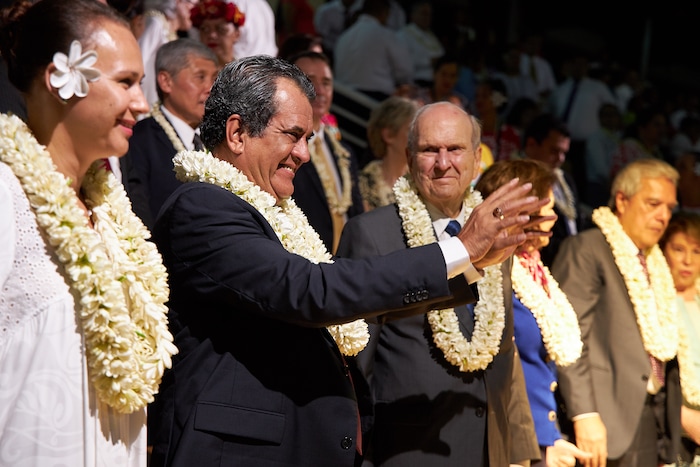 (The Church of Jesus Christ of Latter-day Saints) French Polynesian President Édouard Fritch, second from left, joins Russell M. Nelson at a cultural celebration marking the 175th anniversary of the arrival of the first Latter-day Saint missionaries to the island.