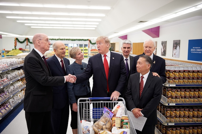 (The Church of Jesus Christ of Latter-day Saints) Russell M. Nelson, second from left, is among church leaders greeting President Donald J. Trump during a visit to the church's Welfare Square on Dec. 4, 2017.
